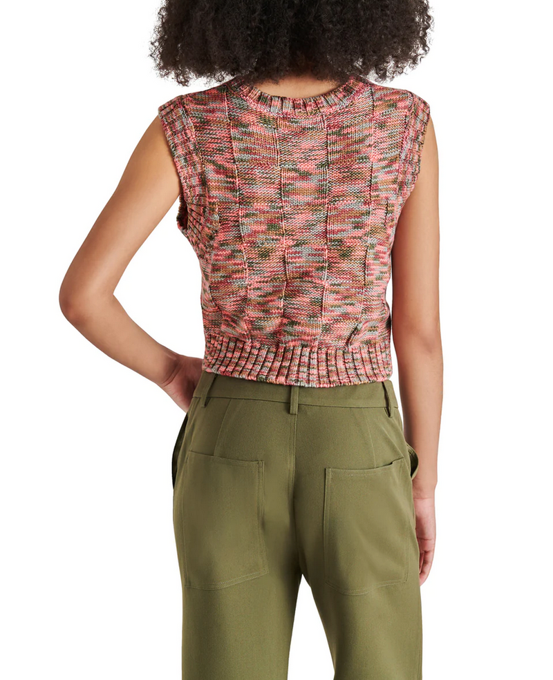 back view of model in tank. shows knit fabrication, contrast ribbing detail and multi color yarn