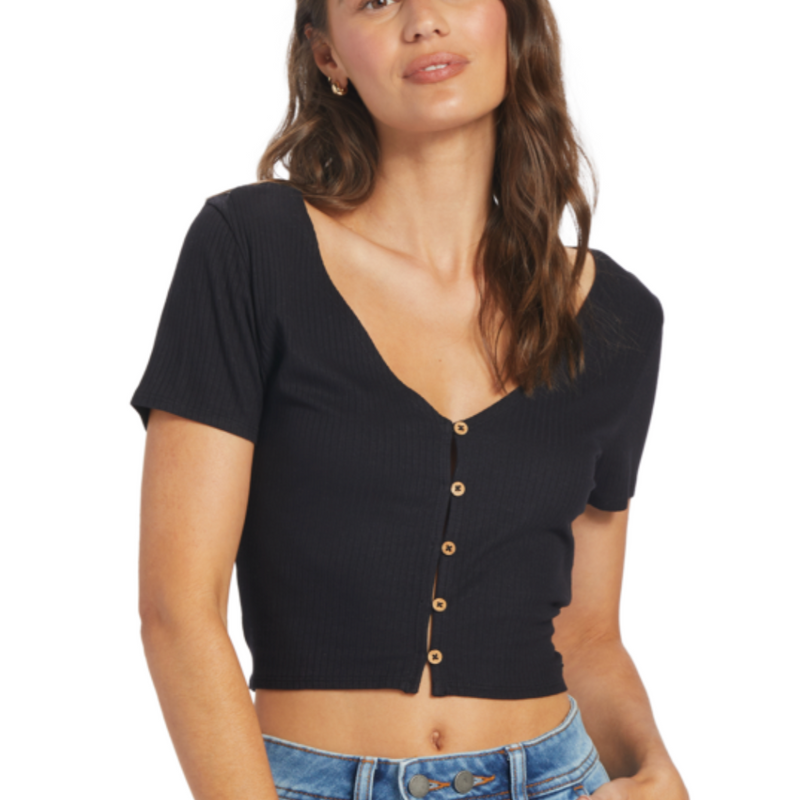 shows front view of model in shirt. you can see the deep v-neckline leading into 5 buttons down the front. the top hits the model above the belly button.