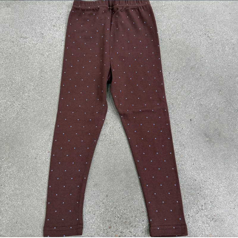 Brown pants with a subtle pattern on a gray surface