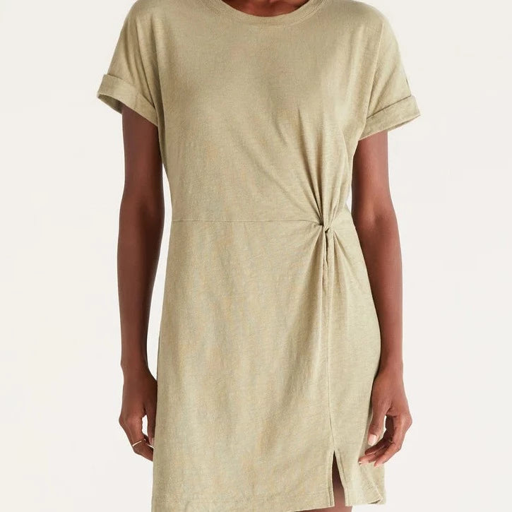 Front view of mini, t-shirt dress in olive. Shows the rolled sleeves, crew neckline, twist detail and small front slit.
