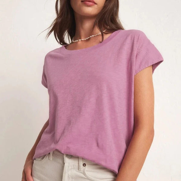 front view of the model wearing the laid back slub top in dusty orchid. shows the scoop neckline. also shows the relaxed fit. also shows the unique sleeve shape.  