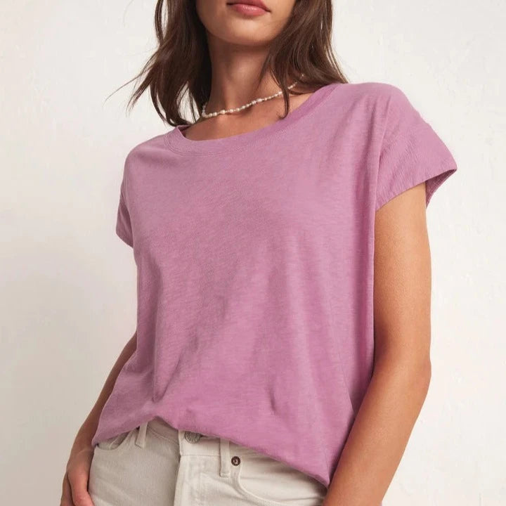 front view of the model wearing the laid back slub top in dusty orchid. shows the scoop neckline. also shows the relaxed fit. also shows the unique sleeve shape.  