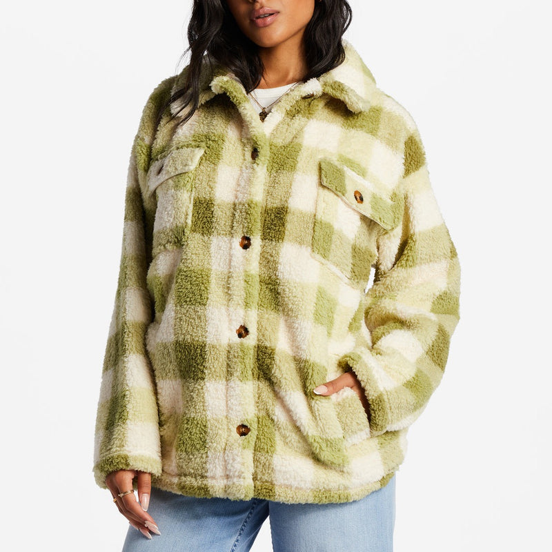 front view of model in jacket. shows the fleece fabrication, buttons down the front, the two chest pockets and side pockets.