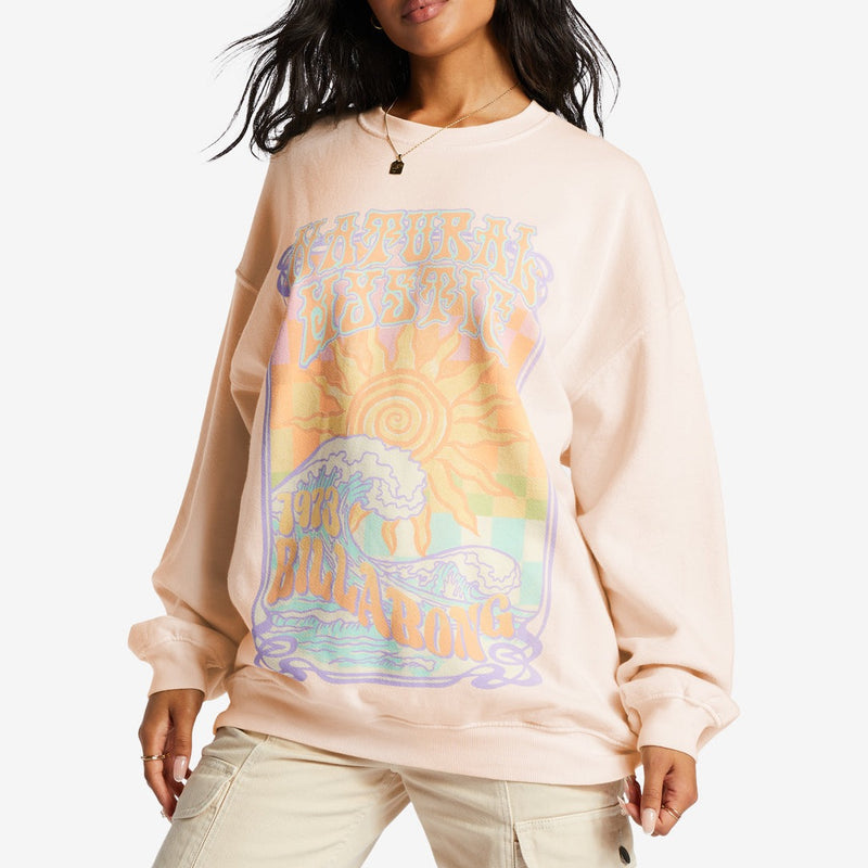 front view of model in graphic sweatshirt. shows the crew neckline, dropped shoulders, long sleeves and oversized fit.