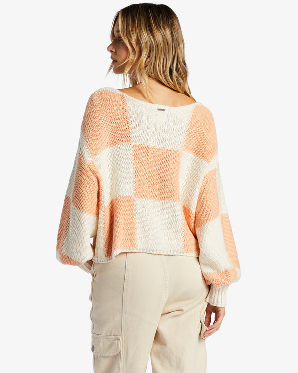 back view of model in sweater. shows the boat neckline and dropped shoulders.