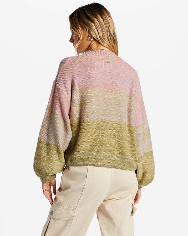 back view of model in sweater. shows the dropped shoulders, puff long sleeves and multi color ombre design.
