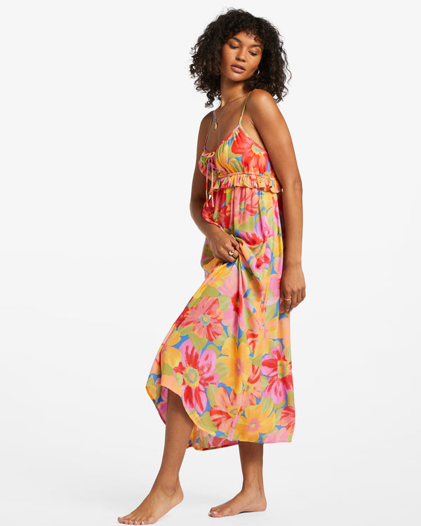 shows an angled view of model in dress. shows the ruffled detail under bust and the midi length.