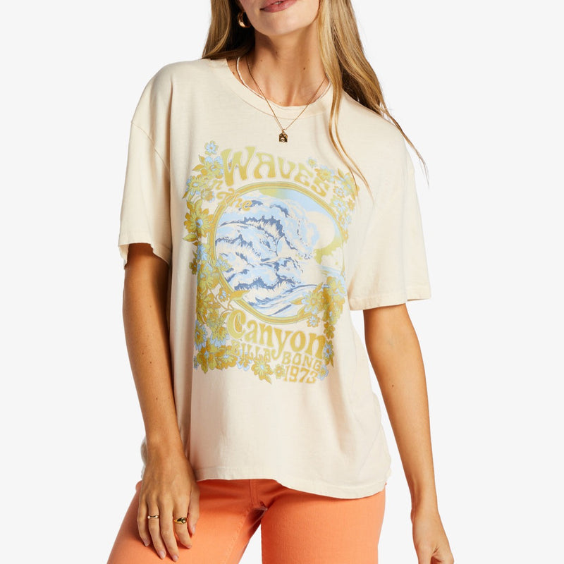 front view of model in shirt. shows an oversized fit, dropped shoulders and a graphic design that says "waves in the canyon"  Edit alt text