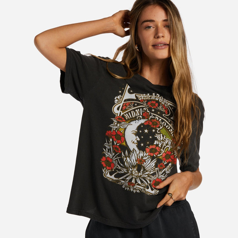 front view of model in shirt. shows a loose fit, crew neckline, and red and white graphic design