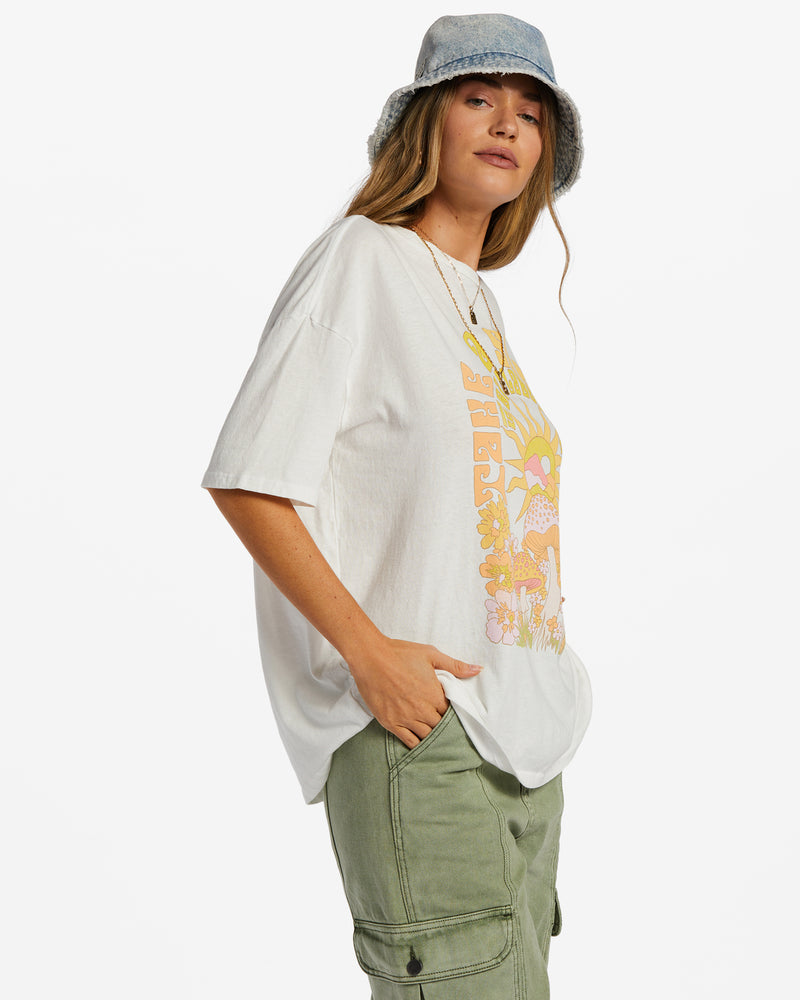 Side view of oversized graphic tee. Shows dropped shoulders and oversized fit.