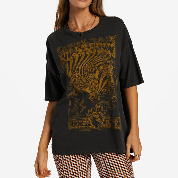 front view of model in t-shirts. shows the oversized fit and dropped shoulders. features a large yellow graphic print of 3 skeletons.