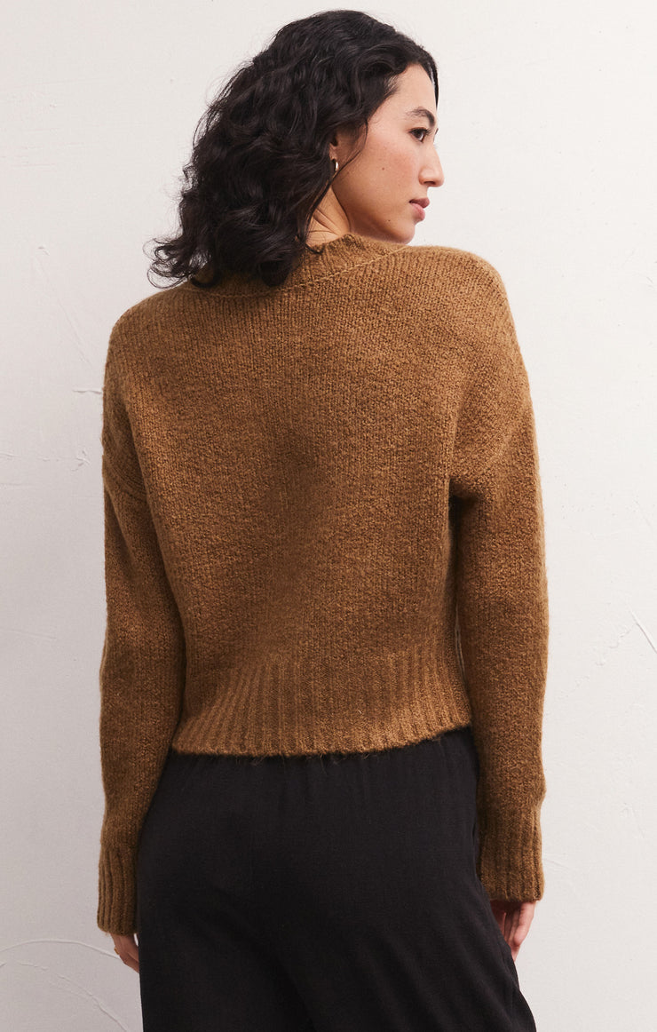 back view of the Allegra cardigan in camel. shows the drop shoulders. also shows the ribbed detailing on the cuffs and the hem and the skimmer length. 
