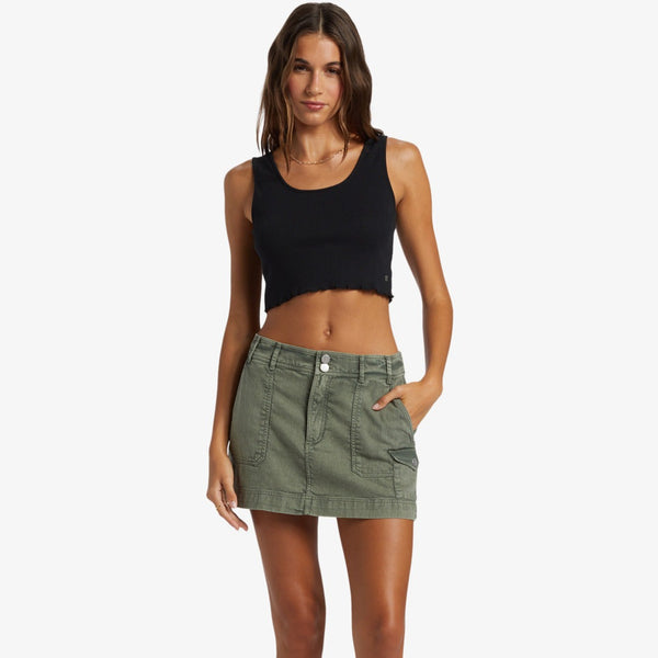 front view of the model wearing the roll with it skirt. shows the low waist. also shows the patch pockets, the two button closure and the princess seaming. 