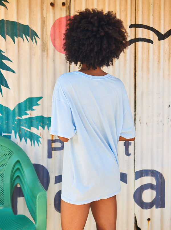 back view of model wearing the star chart t shirt. shows the oversized fit and the crew neckline. 