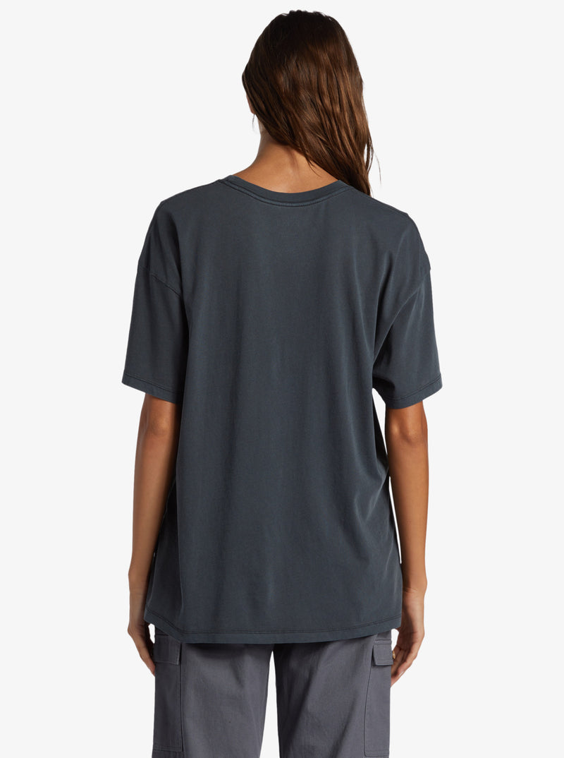 back view of the model wearing the beachy days t shirt. shows the dropped shoulders.  Also shows the crew neckline and the oversized fit. 