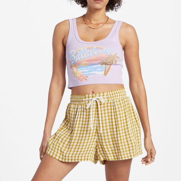 front view of the model wearing the day tripper shorts. shows the elastic waist. also shows the drawcord closure, the side slash pockets and the high rise waist. 