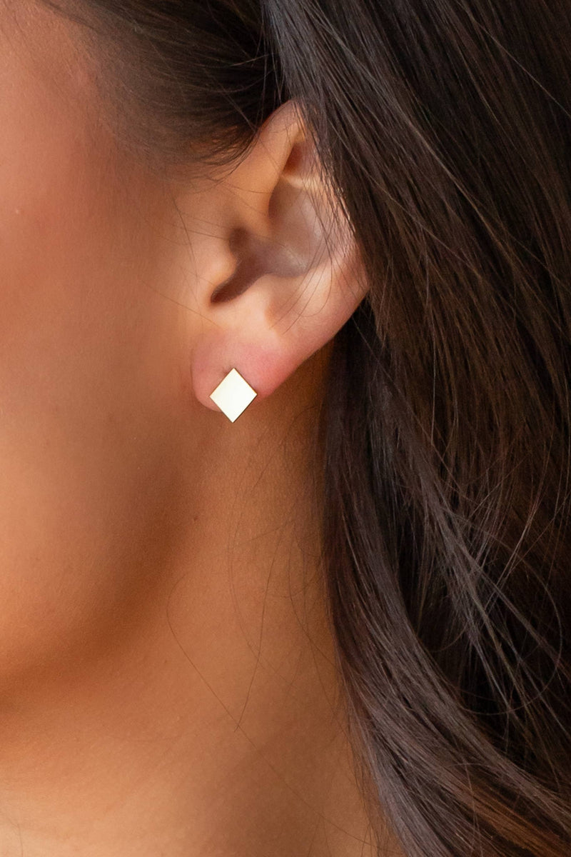 view of the square stud earring. shows the gold square stuff earring. 