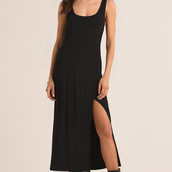 front view of the melbourne dress. shows the scoop tank neckline. also shows the front slit, and the fitted bodice.