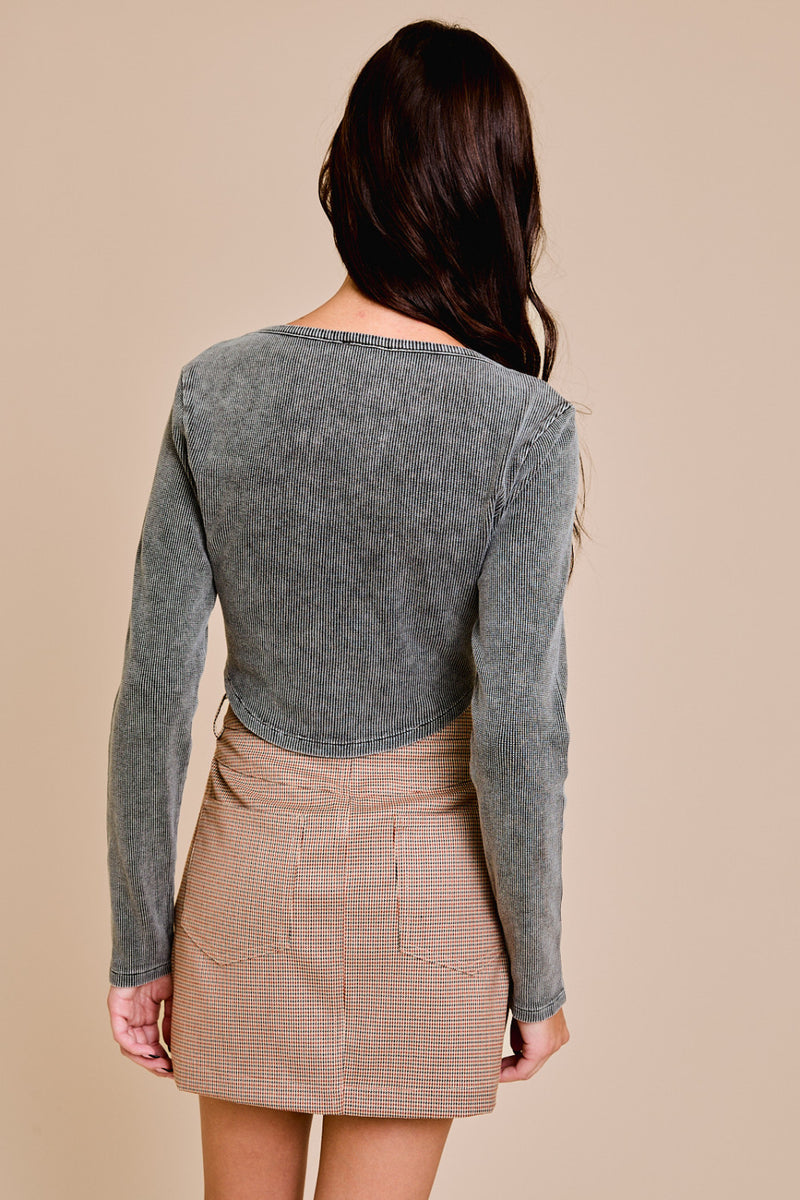 back view of the ellie long sleeve washed waffle crop top. shows the bottom curved hem. also shows the crop length and the long sleeves. 