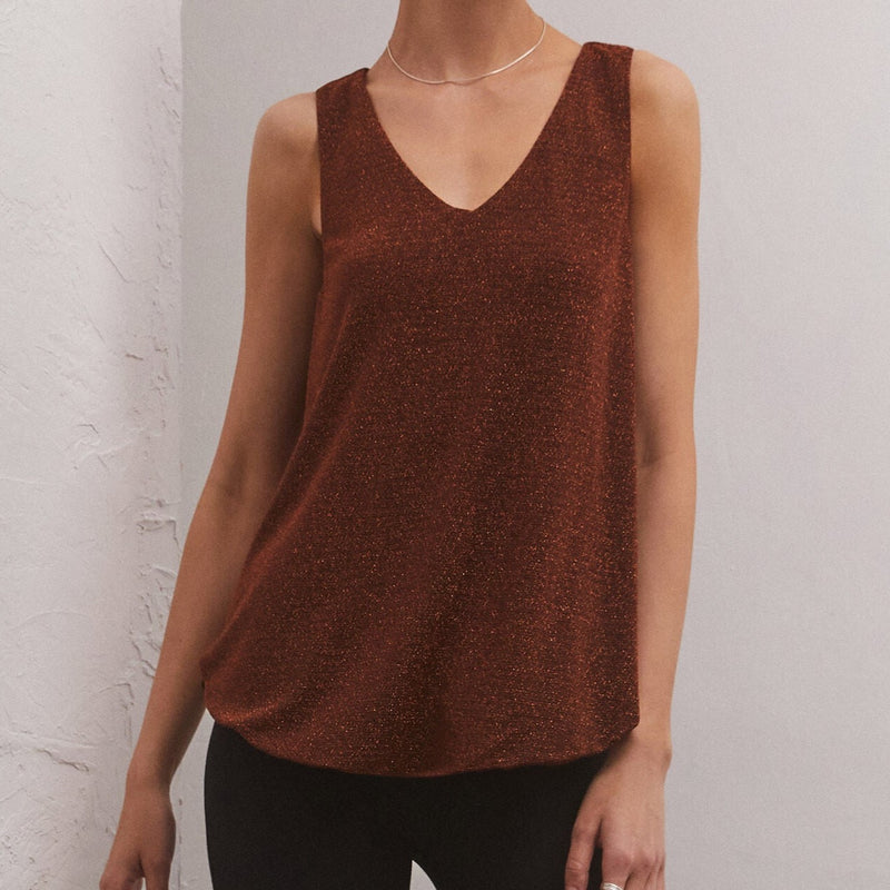 front view of model wearing the vegabond tank in chocolate. shows the v neckline. also shows the sparkle threading throughout, the rounded hemline and that the top is sleeveless. 