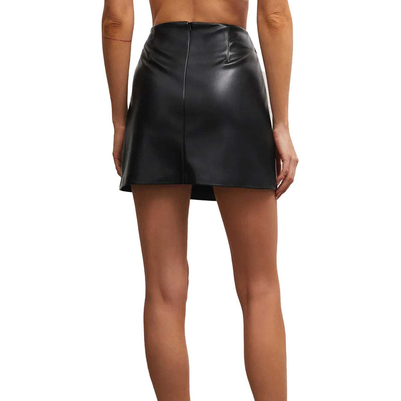 back view of the model wearing the Ciera faux leather skirt. shows the hidden zipper going dow the middle. also shows the darting detail and shows the shininess of the faux leather texture. 