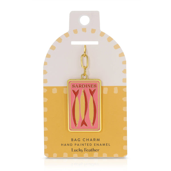 Sardine bag charm on a polka dot card with 'Lucky Feather' branding.
