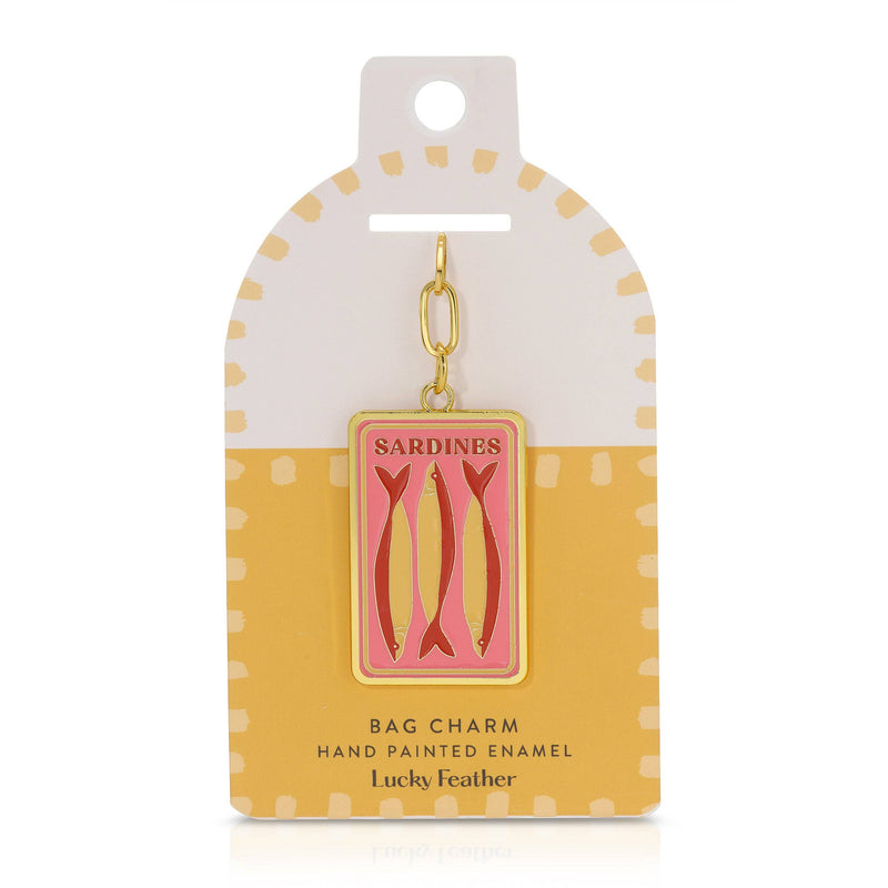 Sardine bag charm on a polka dot card with 'Lucky Feather' branding.