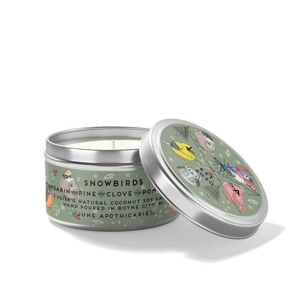 Candle tin with decorative lid featuring illustrations on a white background