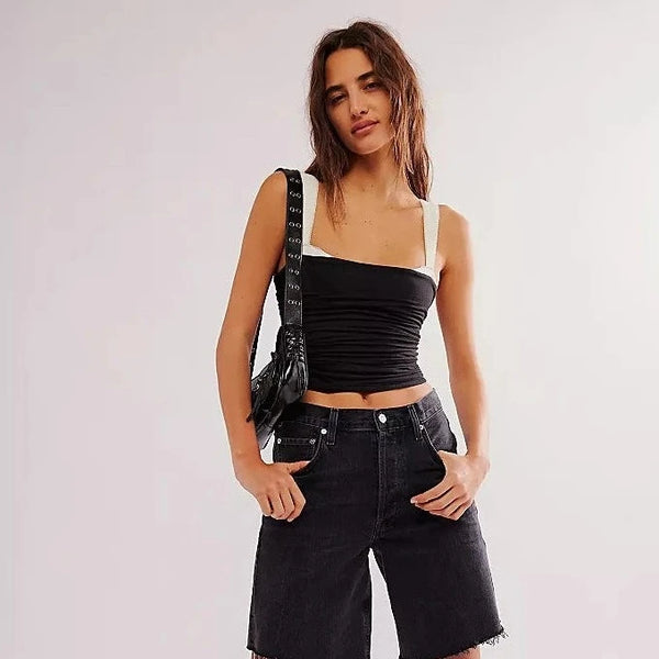 front view of the model wearing the 2 tone tank. shows the slim fit. also shows the slightly wider straps, the look of a tank under a tube top and the square neckline. 