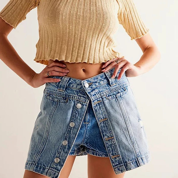 front view of the model wearing the midnight sun skort.  shows the front down button closure. also shows the shorts underneath with a zipper closure, the mid-rise and the a-line fit. 
