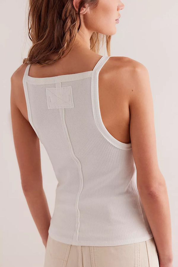 back view of the model wearing the mia tank. shows the square neckline. also shows the seam down the middle, the dropped armholes, the ribbed detailing and the slim fit. 