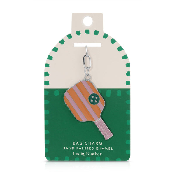 Bag charm on a green and beige card with 'Lucky Feather' branding