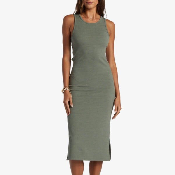 front view of the model wearing the good keepsake midi dress. shows the scoop neckline. also shows the bottom side slits, the fitted style and midi length. 