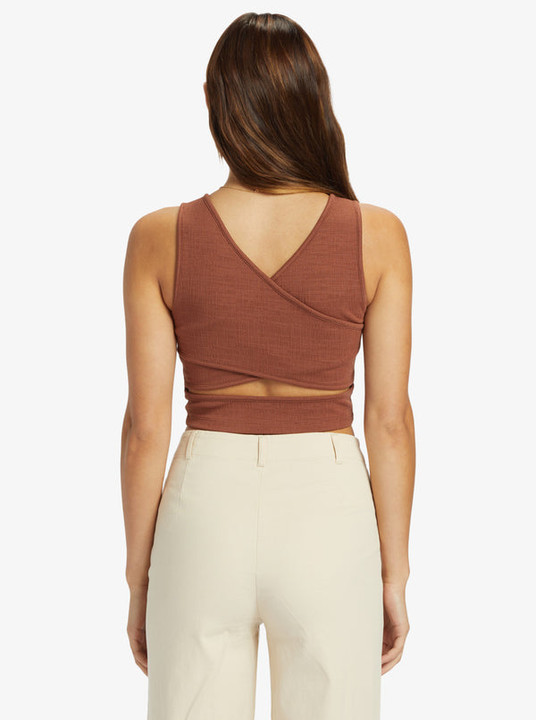 back view of the good keepsake crop top. shows the back deep v neckline. also shows the cross back design, the wide strap and the crop length. 