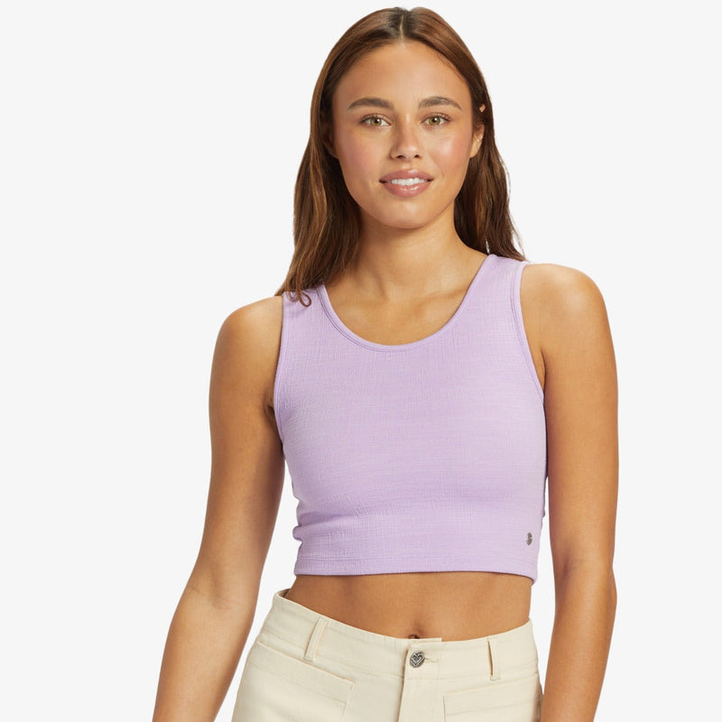 front view of the model wearing the good keepsake crop top. shows the scoop neckline. also shows the wide straps and the cropped length. 
