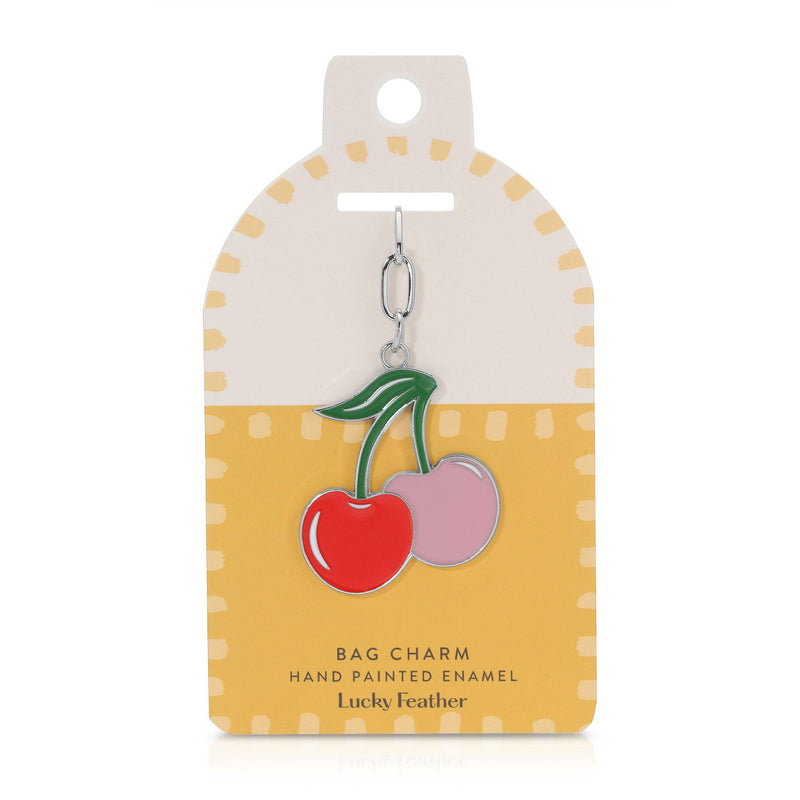 Cherry bag charm on a yellow and white card with 'Lucky Feather' branding.