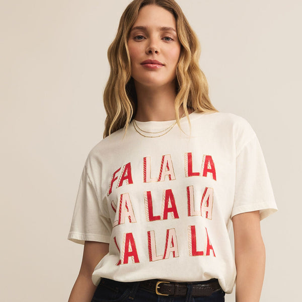 Woman wearing a white t-shirt with red text on a beige background