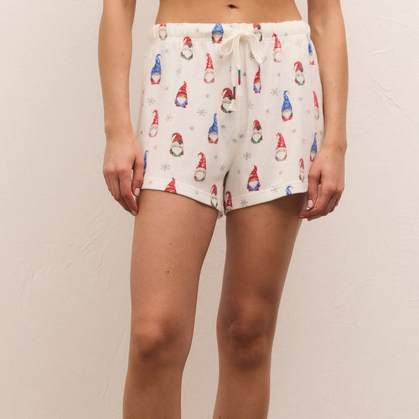 front view of model wearing classic gnome short in vanilla ice. shows the drawstring, also shows the mid rise, the cute gnome print throughout. 