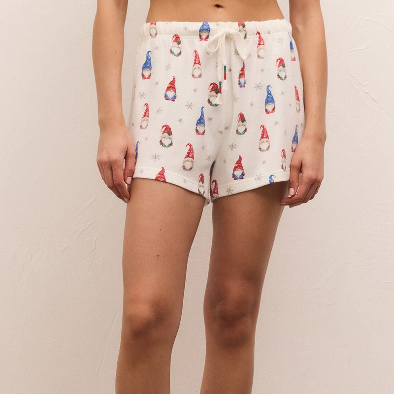 front view of model wearing classic gnome short in vanilla ice. shows the drawstring, also shows the mid rise, the cute gnome print throughout. 