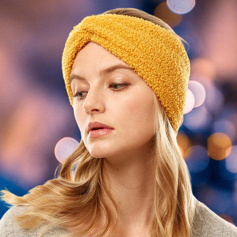front view of model wearing earmuff headband. Shows the front tie knot detail and the sherpa fleece material in this mustard color.  