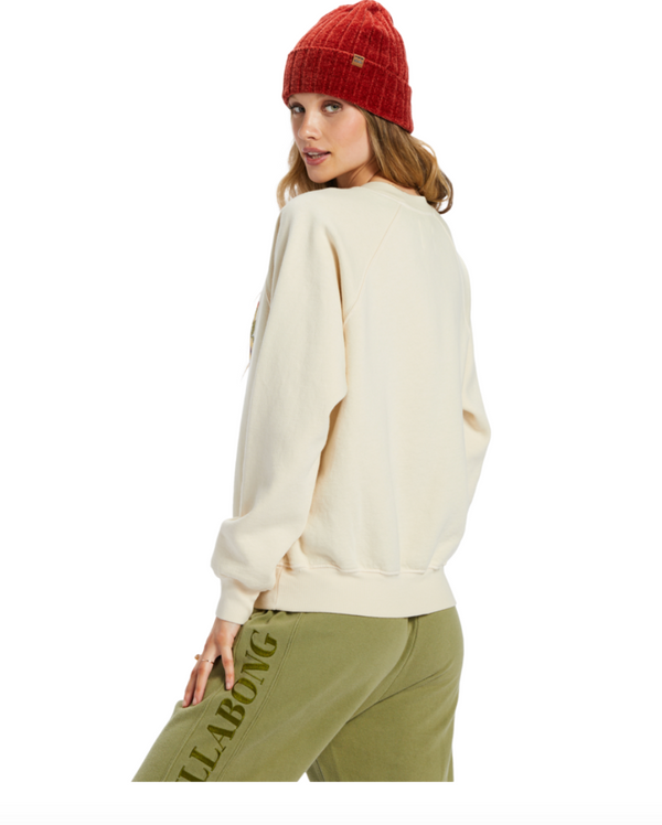 Back/side view of model sweatshirt. Shows the crew neckline. Also shows the ribbed bands and the cream color. 