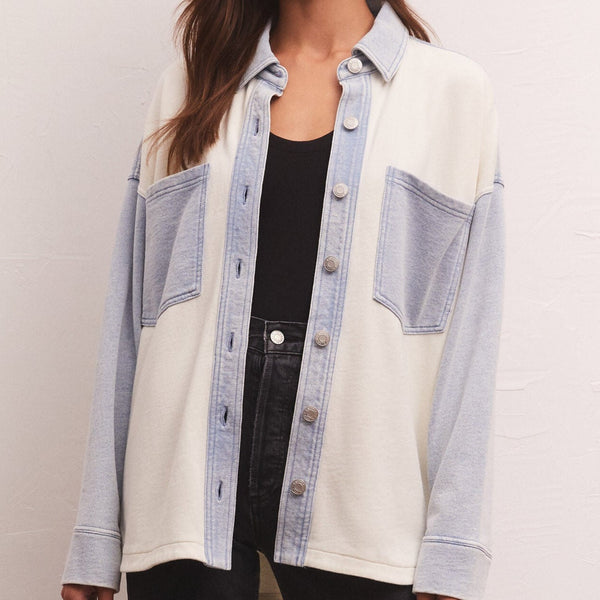 front view of model wearing jacket. shows the color block detail, mineral washed look, front pouch pockets, the dropped shoulders and relaxed fit.