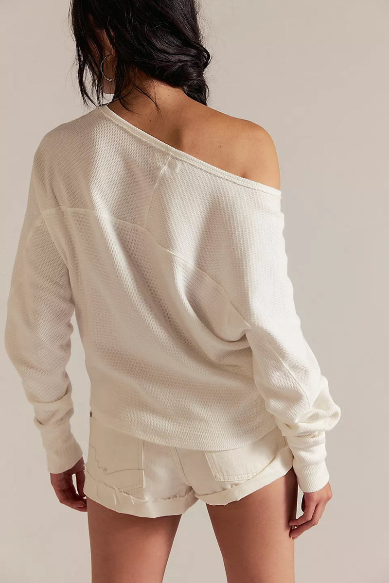 back view of the model wearing the jess long sleeve. shows the neckline ff the shoulder. also shows the ivory color, the dolman sleeves and the thermal texture. 
