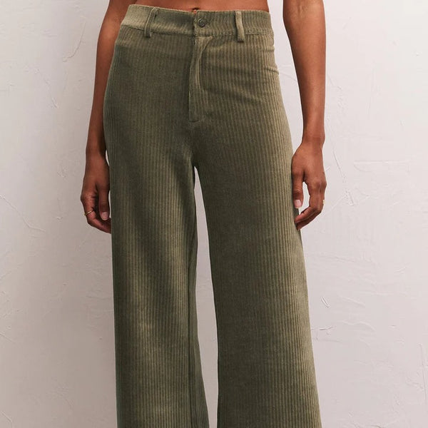 front view of the prospect cord pants in kelp. shows the belt loops. also shows the zipper and button closure, and the ribbed knot corduroy detail. 