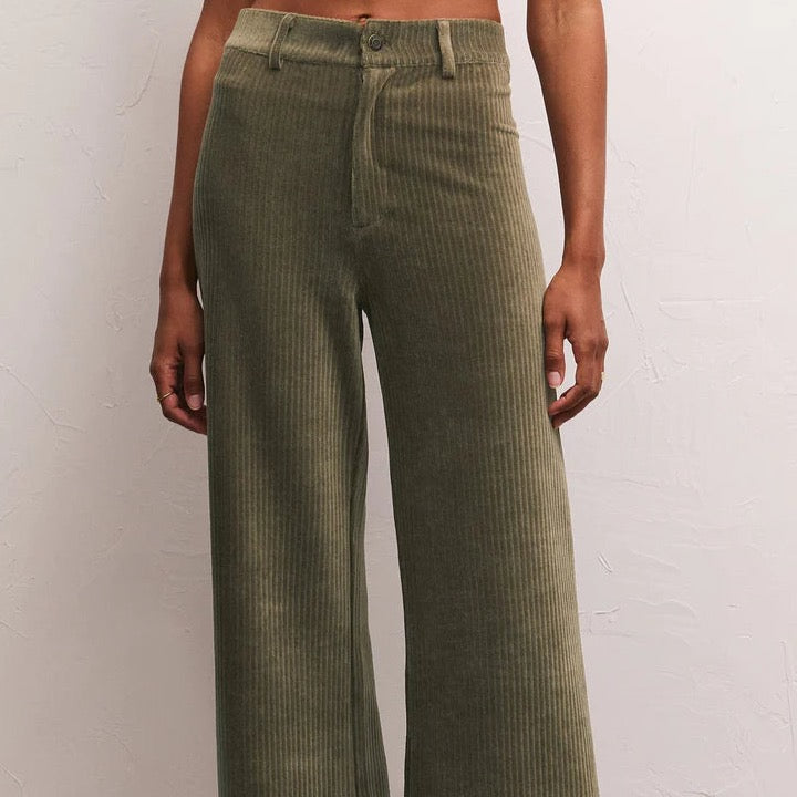 front view of the prospect cord pants in kelp. shows the belt loops. also shows the zipper and button closure, and the ribbed knot corduroy detail. 
