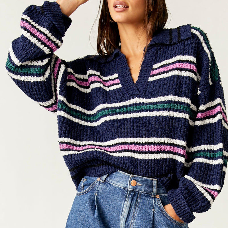 front view of model wearing the Kennedy pullover. shows the collared v neckline. also shows the slouchy fit, the stripe detail and boxy fit. 
