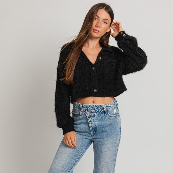 front view of the Chloe cropped shacket in black. shows the button closure. aksi shows the collar, the oversized sleeves and the cropped length. 