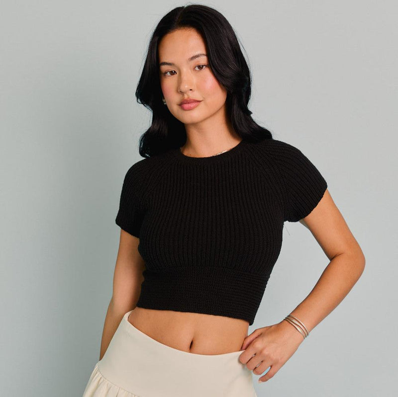 front view of the becky knit top. shows the crew neckline. also shows the cropped length, the short sleeves and the knit detailing. 