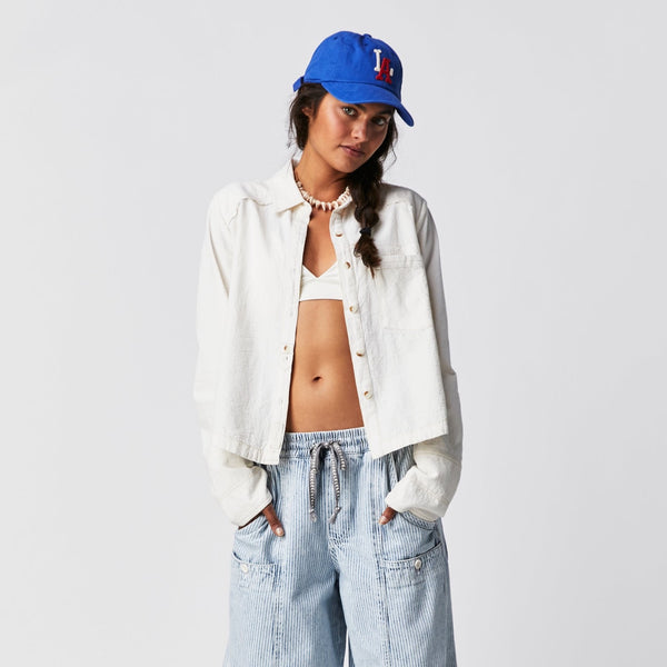 Front view of the model wear the classic Oxford. Shows the classic collar. Also shows the boxy, slight cropped length as well as the front button closure and the front patch pocket. 