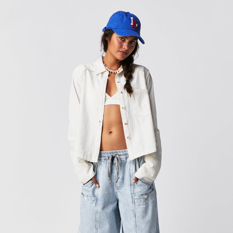 Front view of the model wear the classic Oxford. Shows the classic collar. Also shows the boxy, slight cropped length as well as the front button closure and the front patch pocket. 